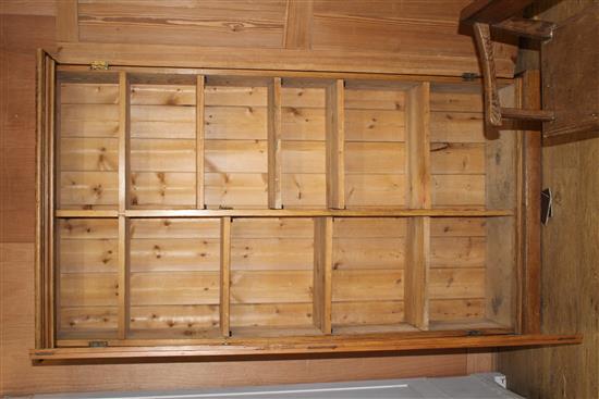 An Edwardian pitched pine hall cupboard, with two panelled doors enclosing two fixed shelves and fittings for adjustable shelves, W.116